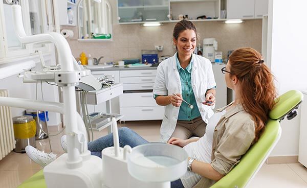 Female dentist with patient